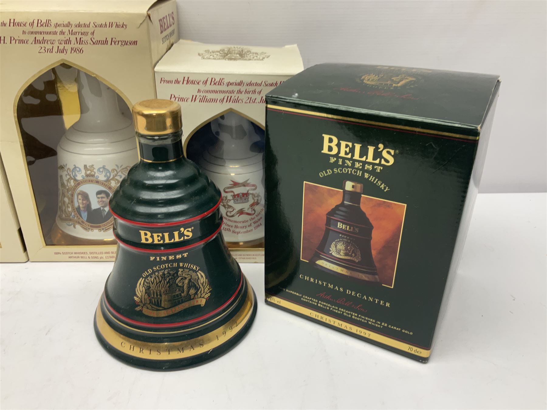 Bells, Scotch whisky, in eight Wade ceramic decanters, including Christmas 1992, Queens 60th birthday, Birth of Prince William etc, various contents and proof   