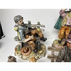 Group of Capodimonte figures, to include musical organ grinder with donkey and monkey, two tramp figures on benches, man with gun and choir boy and girl figures