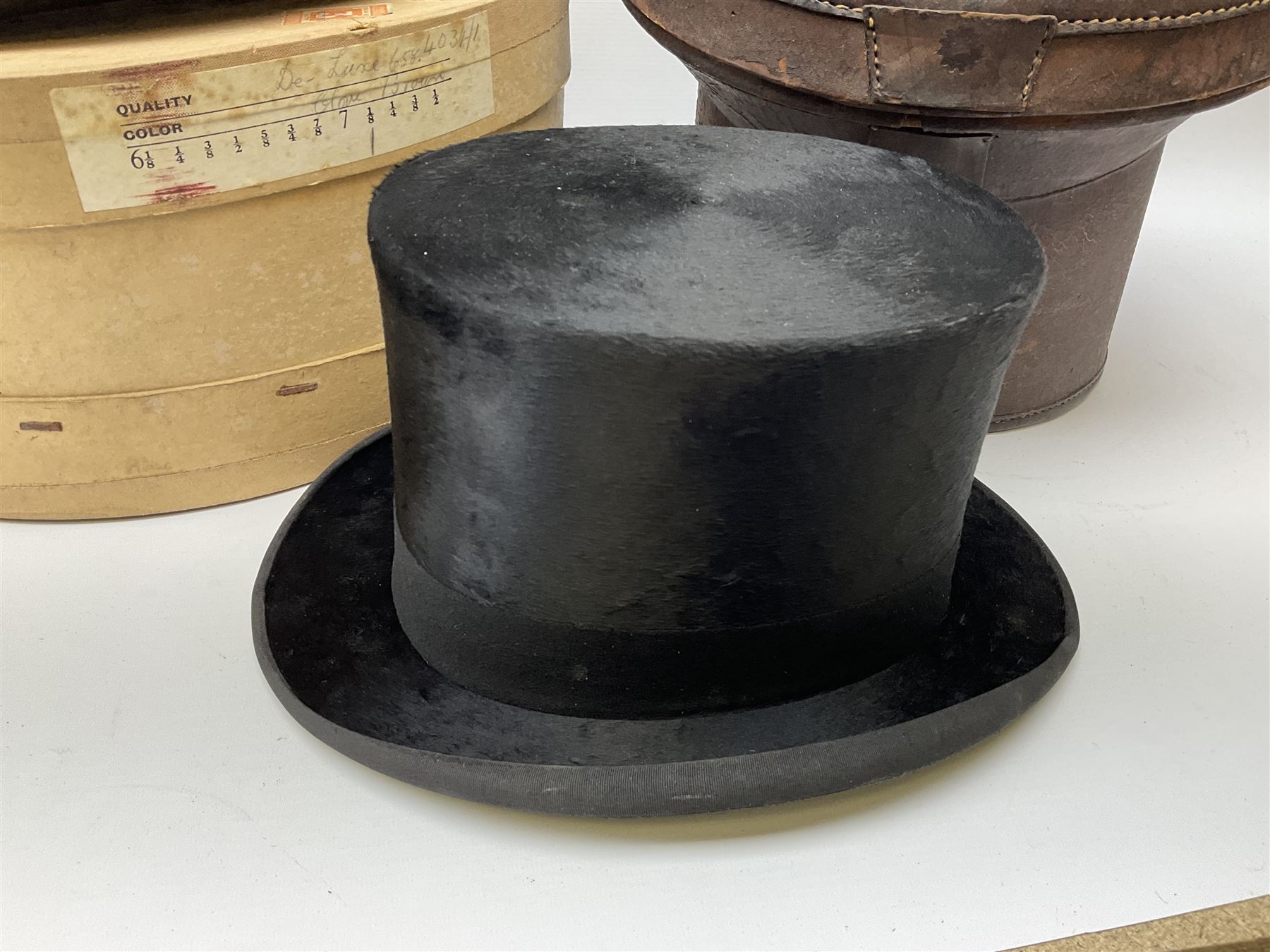Top hat by Tress & Co London, in a  fitted leather leather case,  Top hat by Chapellerie Francaise. 
