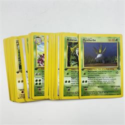 Collection of vintage English and French language Pokemon TCG trading cards, approximately eighty English cards housed in Pokemon file, including Base Set, Base Set 2, Team Rocket, Neo Discovery, Jungle and Fossil examples, with thirteen holos including Charizard 4/102, Dark Blastoise 3/82, Ninetales 12/102, Mewtwo 10/102, and First Edition Machamp 81/102, approximately two hundred French language cards, many first editions, including four first edition holos, Roucarnage 8/64, Nidoqueen 7/64, Melodelfe 1/64 and Mackogneur 8/102, all loose, together with a Funfax Pokemon Collectors File