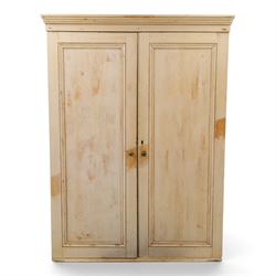19th century stripped pine linen cupboard, projecting cornice over two panelled doors encl...