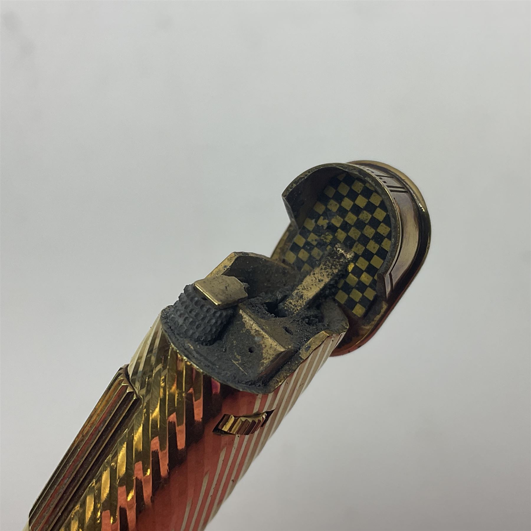 Dunhill gold plated dress lighter, in original fitted case with paperwork, together with a Dunhill rolagas lighter