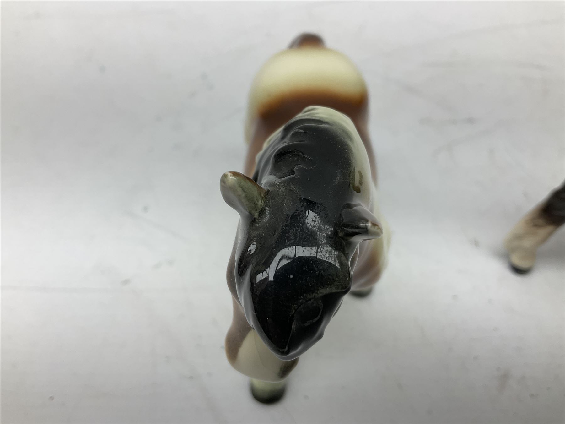 Seven Beswick figures of horses, including Connemara pony in grey no.1641, Arab in bay no.1265, large foal in grey no.947 etc, together with a Goebel figure of a horse (8)