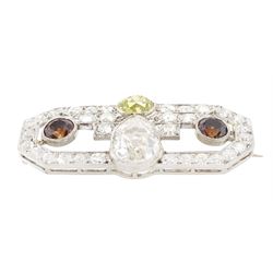 Early 20th century platinum diamond brooch, milgrain set with a pear cut faint brown diamond of approx 1.50 carat, an old cut fancy yellow / green diamond of approx 0.70 carat, and two old cut fancy orange / brown diamonds of approx 0.40 carat and 0.35 carat, surrounded by old cut white diamonds in an openwork setting, total white diamond weight approx 1.45 carat