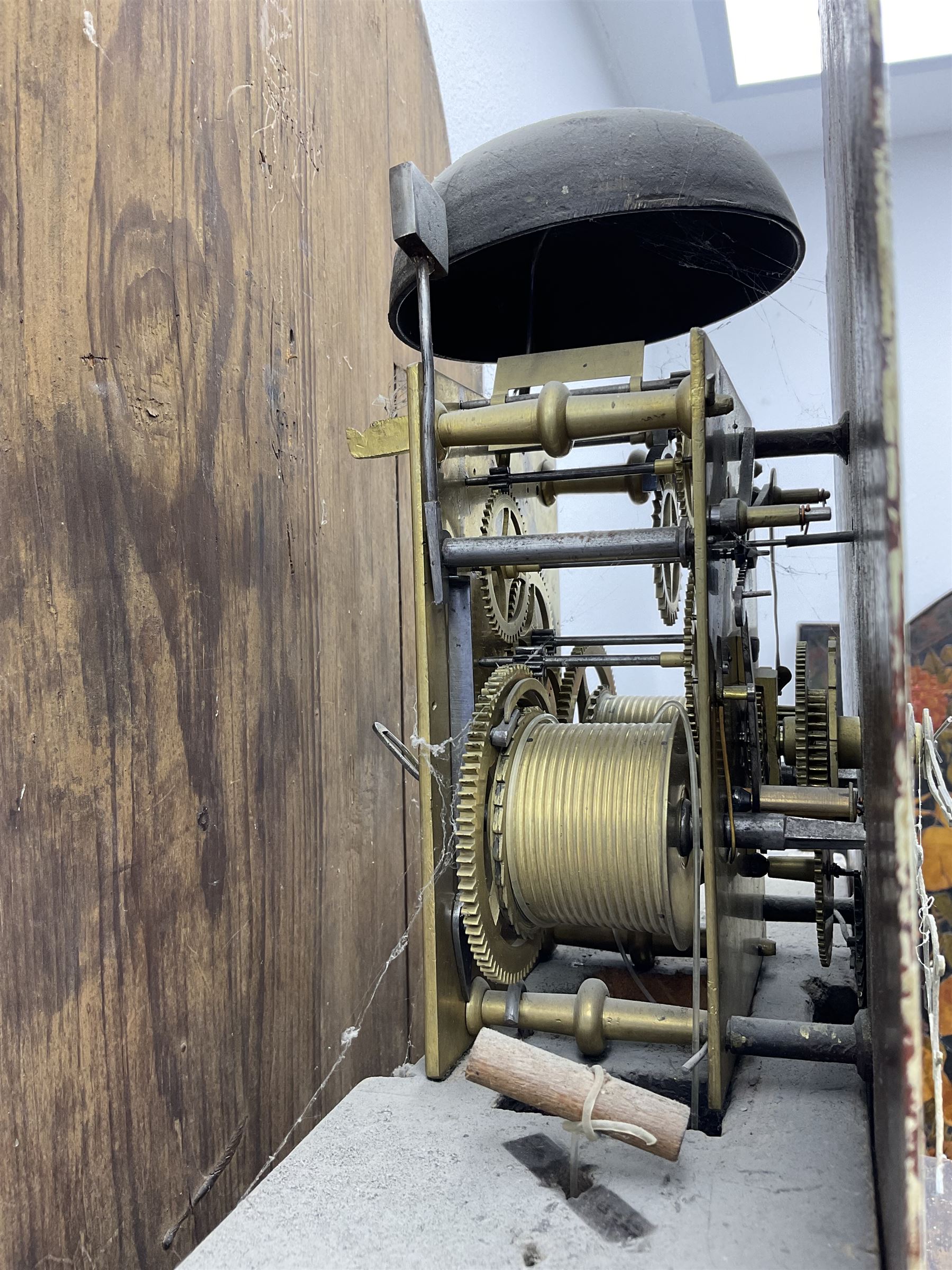 Ayers of Newcastle - 19th century oak cased 8 day longcase clock c1850, with a break-arch top and turned wooden finials, conforming hood door flanked by waisted pilasters and brass capitals, trunk door with an arched top, rectangular plinth with decorative base, painted dial with floral spandrels and a rural depiction to the arch, Roman numerals and minute track, with matching brass hands and subsidiary seconds and date dials, dial pinned directly to a rack striking movement, sounding the hours on a bell. With pendulum and weights.