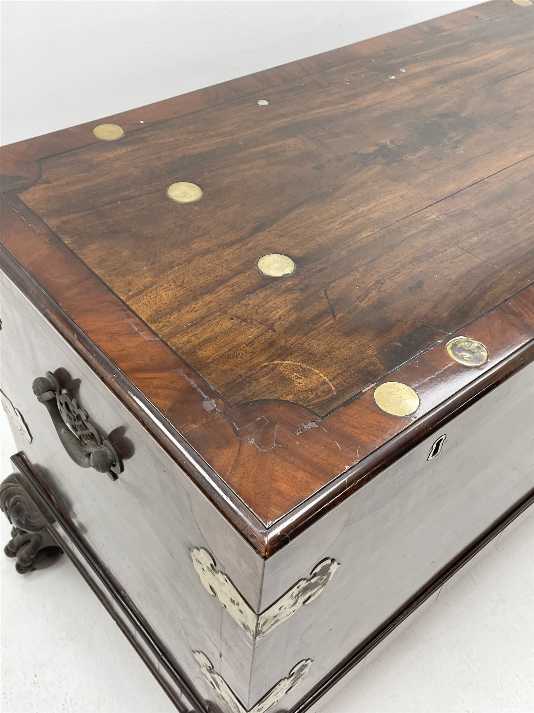 19th century camphor wood and mahogany silver chest, the hinged banded top with circular brass mounts which secure the interior strap hinges, fretwork metal strapping to the corners, on stand with plain frieze and acanthus carved cabriole ball and claw feet