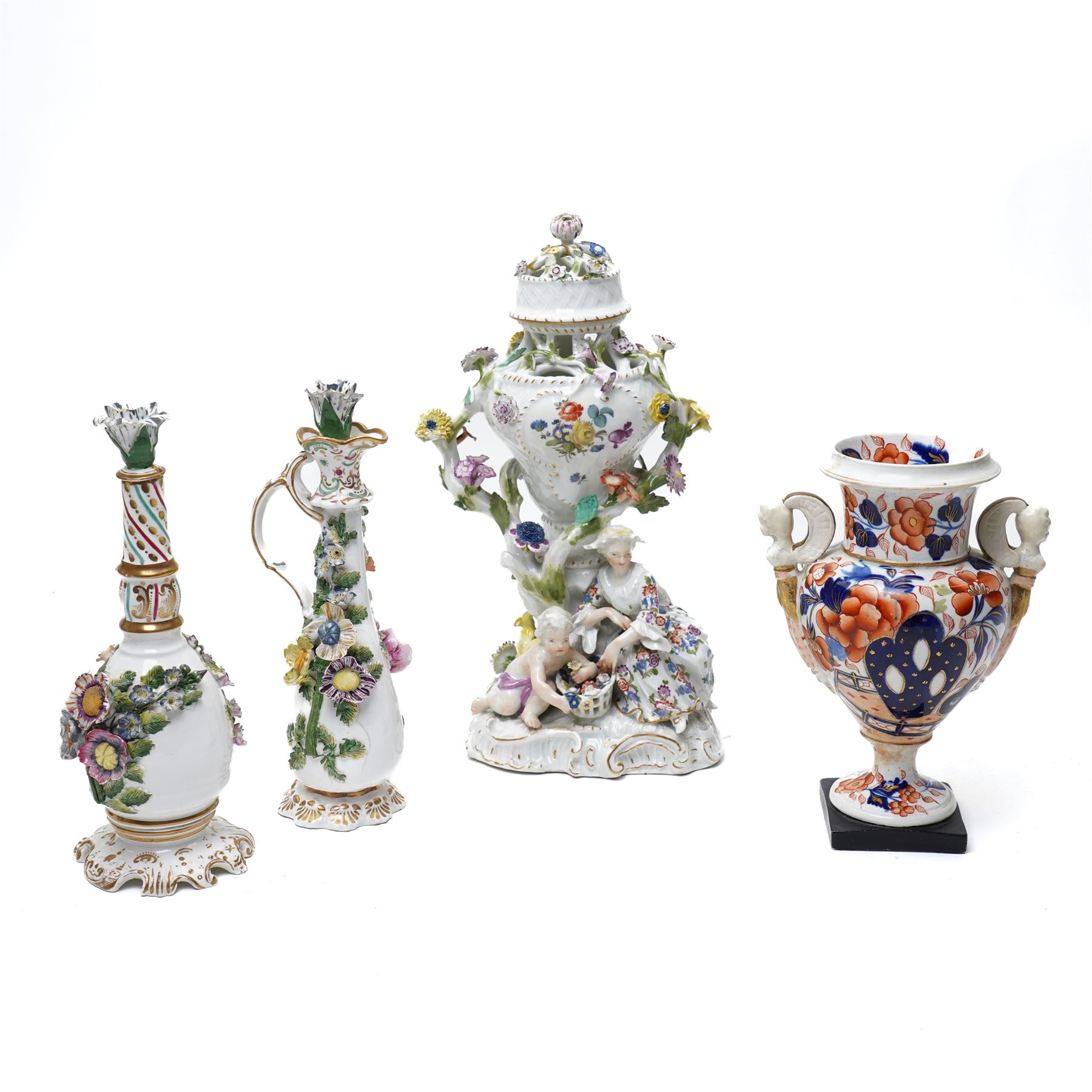 19rh century German porcelain centrepiece with pierced cover decorated with applied flowers and figures at the base H31cm,  near pair of scent flasks with applied flowers and a two-handled vase
