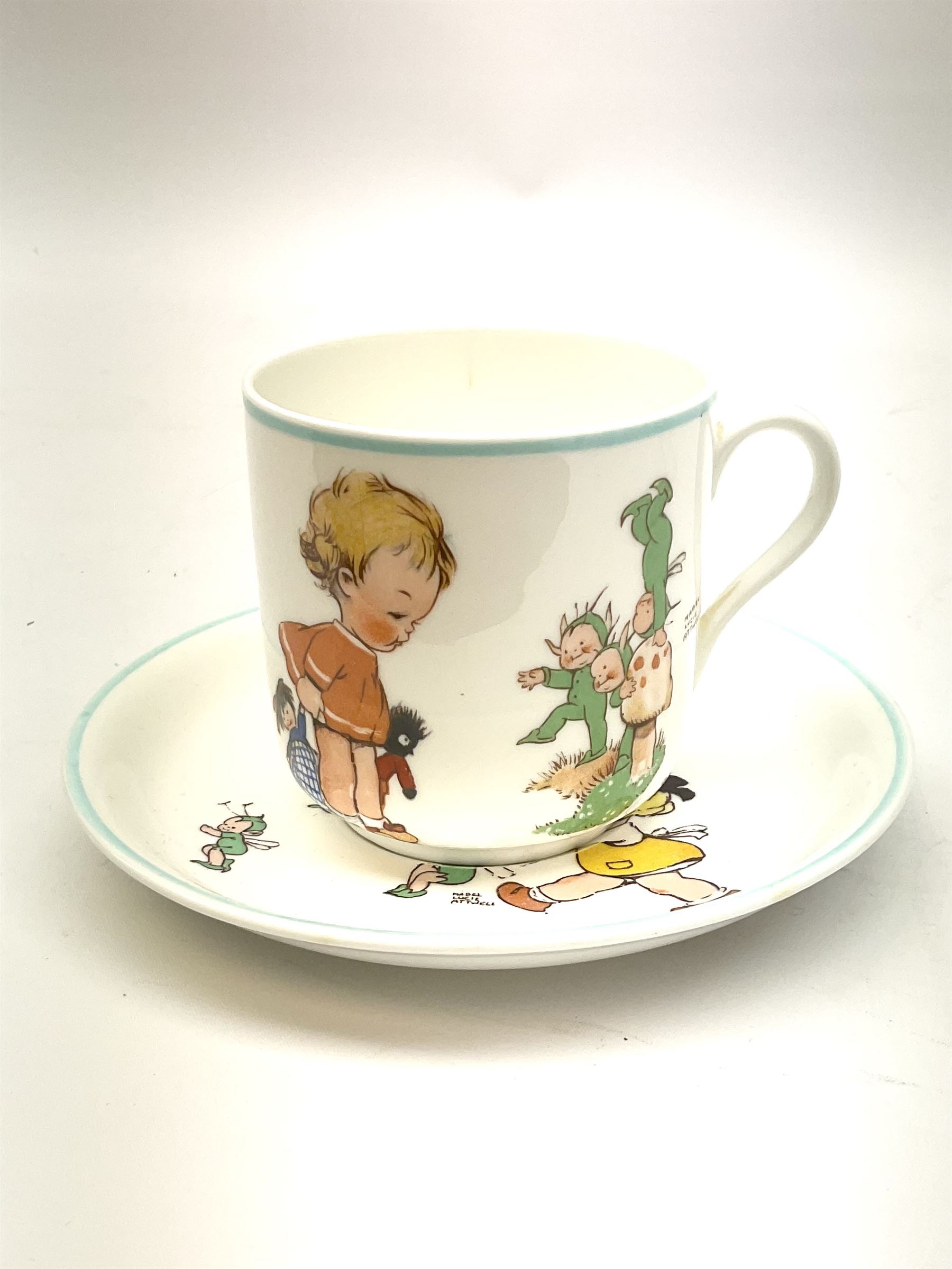 Shelley Boo Boo three piece tea set designed by Mabel Lucie Attwell, comprising teapot modelled as a house, sugar bowl modelled as a toadstool, and creamer modelled as an elf, each with printed marks beneath, together with a Shelley Mabel Lucie Attwell teacup and saucer. 