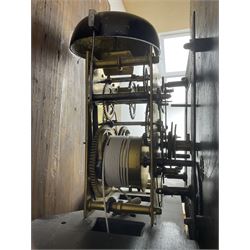 Charles Fletcher of Barnsley - Oak and Mahogany 8-day longcase clock, c 1830, with a swans neck pediment, silk backed open fret work beneath and a break arch hood door, flanked by reeded pilasters with wooden capitals, trunk with reeded quarter columns and a break arch topped door, plinth with inlaid banding on a shaped base, painted dial with Arabic numerals, seconds and date dials, stamped brass hands and painted depictions of the four seasons to the spandrels, dial pinned via a false plate to a rack striking movement with a recoil anchor escapement, striking the hours on a cast bell. With weights and pendulum.