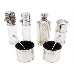 Four silver mounted glass scent bottles,