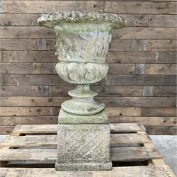 Ornate cast stone centrepiece urn, circular bowl cast with figures, raised on square lattice base