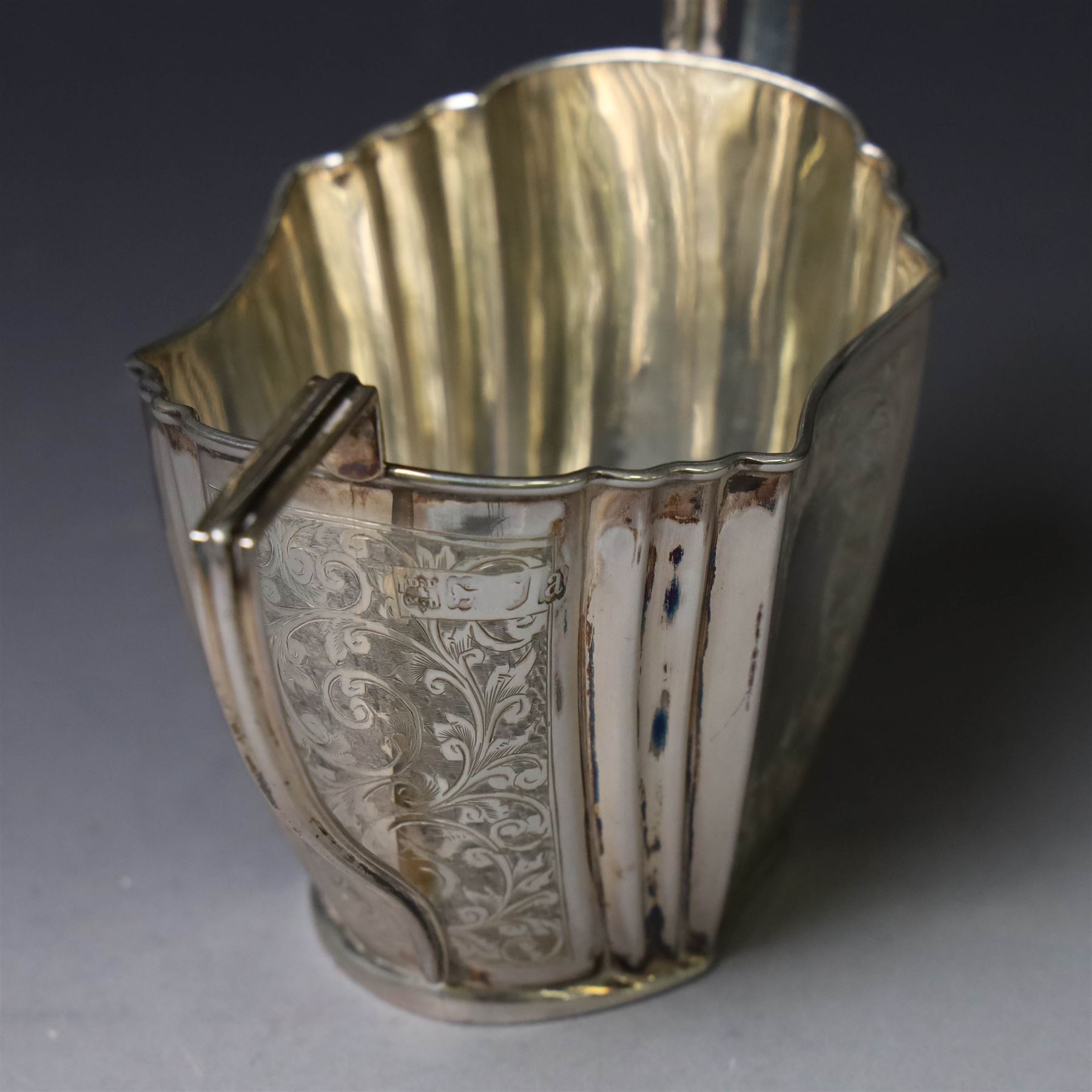 Late Victorian silver twin handled open sucrier and milk jug, of fluted form with panels of engraved foliate decoration, hallmarked D & M Davis, London 1896