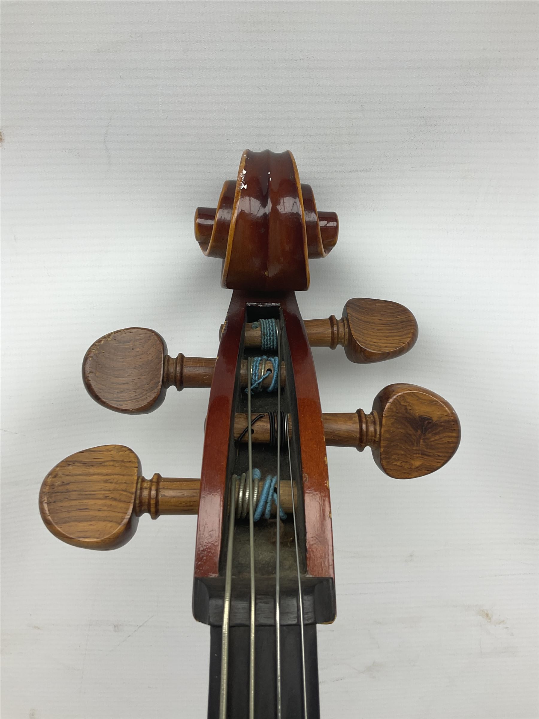 Two student half-size cellos - Boosey & Hawkes Artia with 65cm one-piece back and spruce top; bears maker's label; L104cm overall; and Romanian with 65.5cm two-piece maple back and ribs and spruce top; bears label; L108.5cm overall; each in soft carrying case with two bows (2)