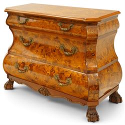 Colombo Mobili - Italian walnut and floral marquetry bombé commode chest, rectangular top with canted eared corners inlaid with urn motif and trailing scrolling foliage, fitted with three long graduating drawers with gilt metal handles, profusely inlaid with scrolling acanthus leaves interspersed with urns and cartouches, on large carved ball-and-claw feet