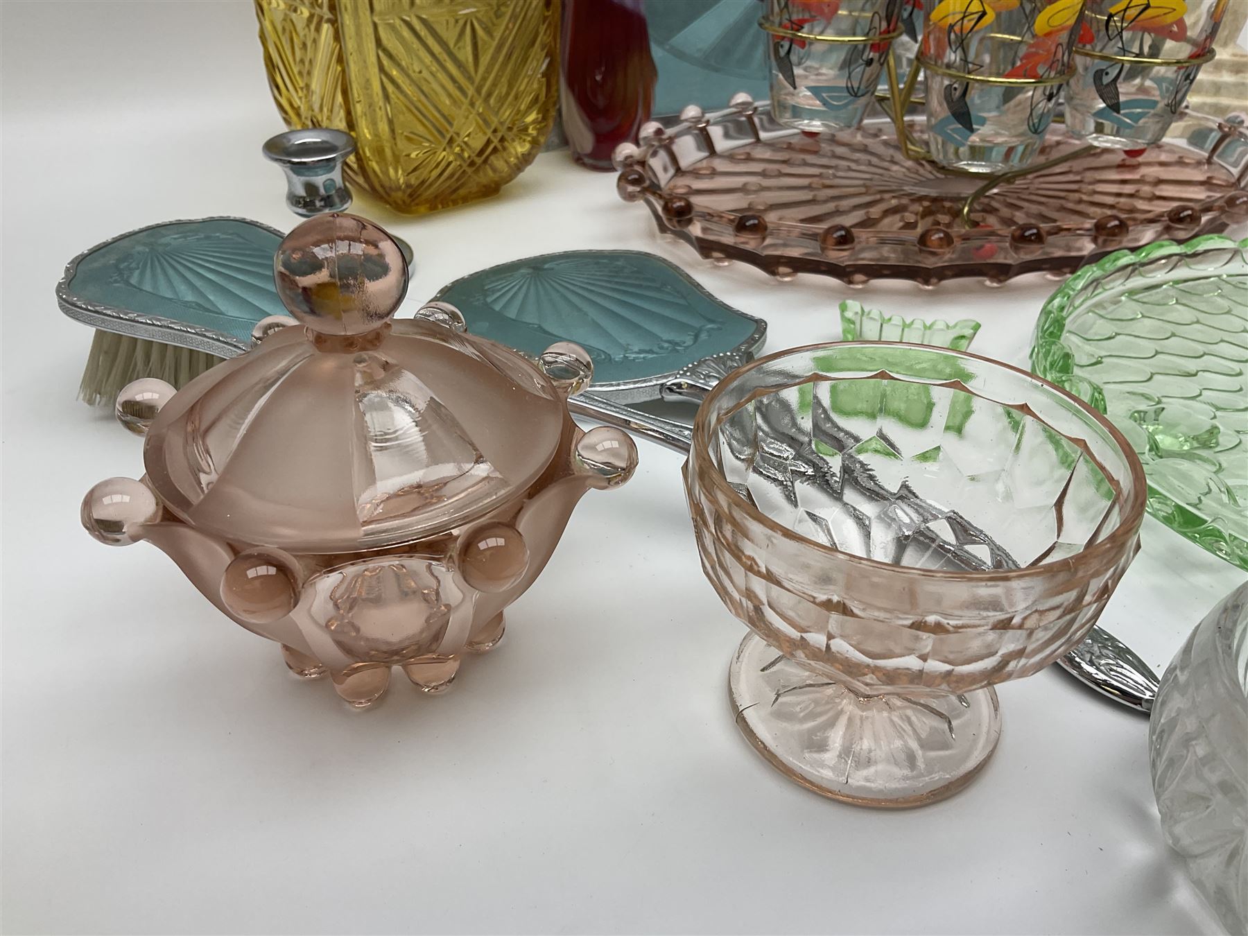 Swedish Svenskt Glass limited edition blue glass salmon, modelled by Paul Hoff, together with two vintage moulded coloured glass dressing table sets with jars and trays, spinning shot glass holder with abstract design glasses and an Art Deco vase, etc 