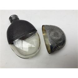 Silver plated glass and pressed leather hip flask, with swivel cap and removable cup, together with a similar oval example, engraved with wreath and initial B, tallest H16.5cm