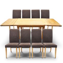 Modern solid oak extending dining table and eight upholstered chairs, the table of plank t...