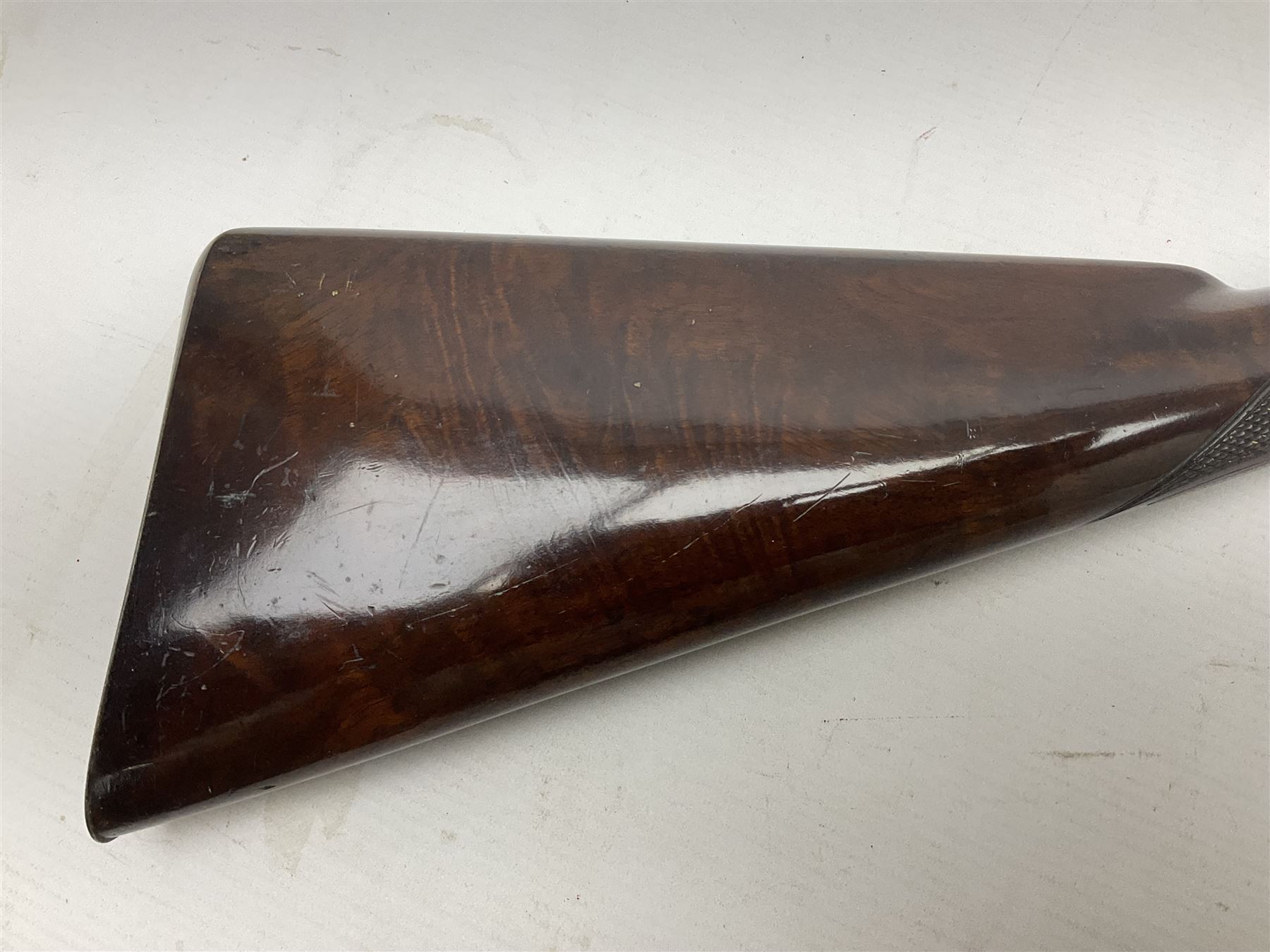 Mid-19th century percussion rifle by Geo. Forrest & Sons of Jedburgh No.844, 79cm octagonal barrel (approx .45 bore) with folding foresight, the lock plate with dolphin hammer finely engraved with a tiger and a stag, trigger guard engraved with hounds chasing a stag, figured walnut half stock with chequered grip and original ramrod 121cm overall; with framed photograph of original owner Dr. A.B. Dresser and archive of related ephemera including manuscript letter from the makers to Dr. Dresser regarding the sight specifications.