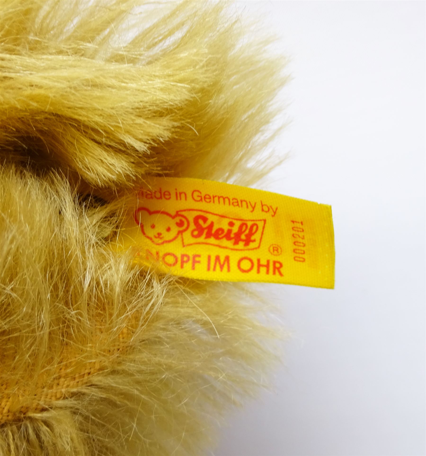 Steiff Replica 1903 Classic teddy bear, the golden mohair body with press squeaker and card tag No.000201 H21