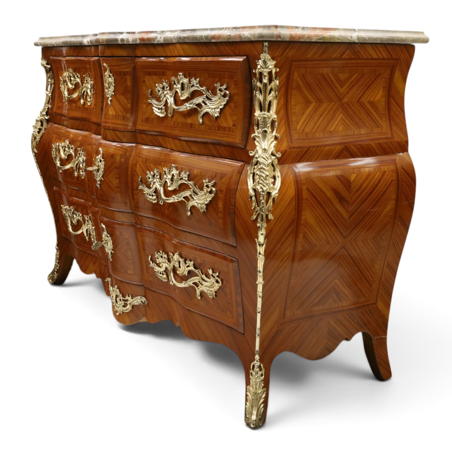 Colombo Mobili - Italian Louis XV design kingwood and marquetry bombé commode chest, the shaped marble top with moulded edge, fitted with an assortment of three shaped short drawers over two long, each with parquetry veneered facias and rocaille shaped gilt metal handles and escutcheons, flanked by gilt metal cartouche mounts with scroll and foliate detail, shaped apron on splayed bracket feet