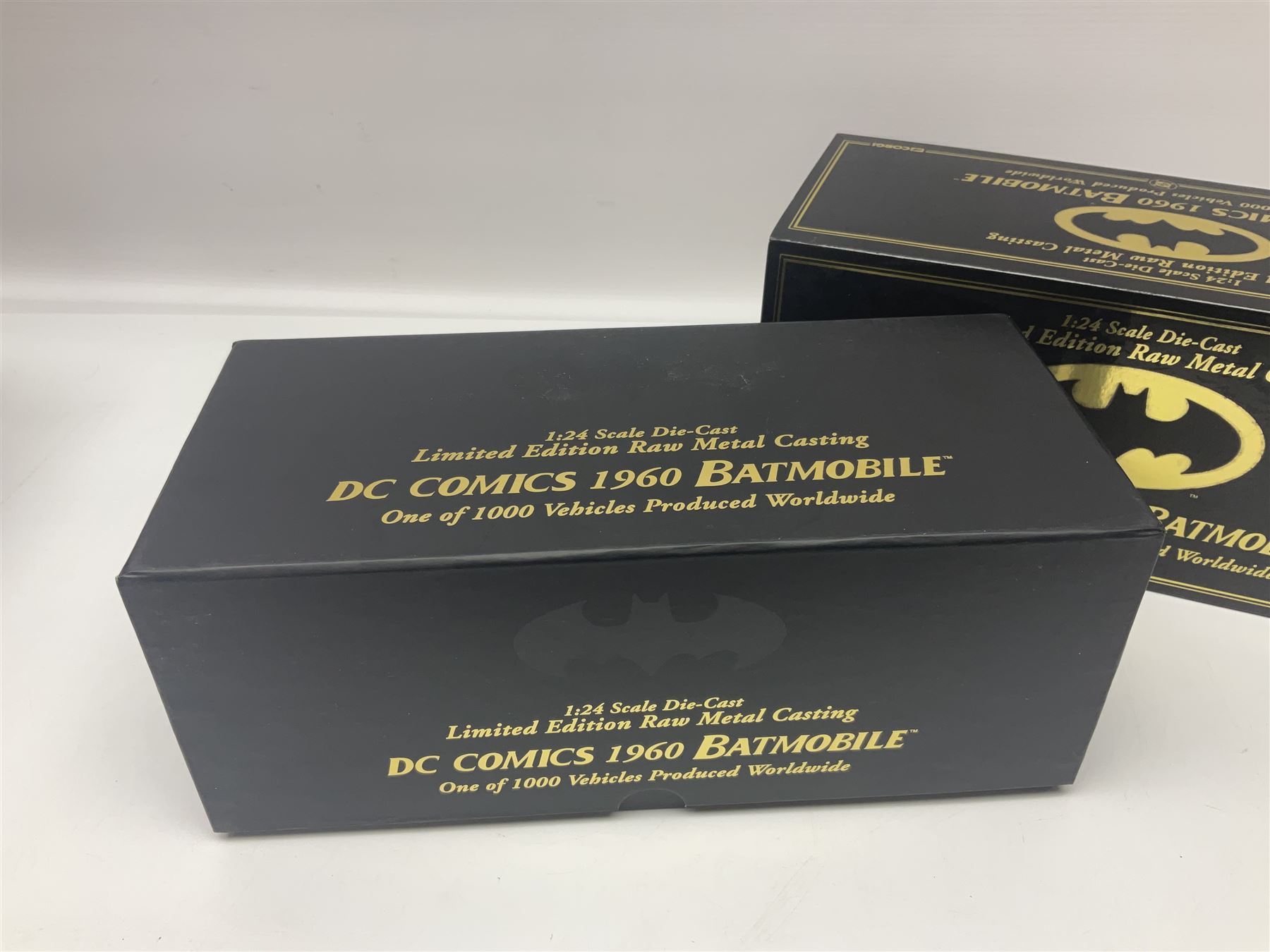 Two Corgi DC Comics die-cast Batmobiles comprising 1:18 scale die-cast Limited Edition Pre-Production Raw Metal Casting 1940 Batmobile Roadster no. 184/300, and 1:24 scale die-cast Limited Edition Raw Metal Casting 1960 Batmobile no. 858/1000, both with original boxes and certificates of authenticity 
