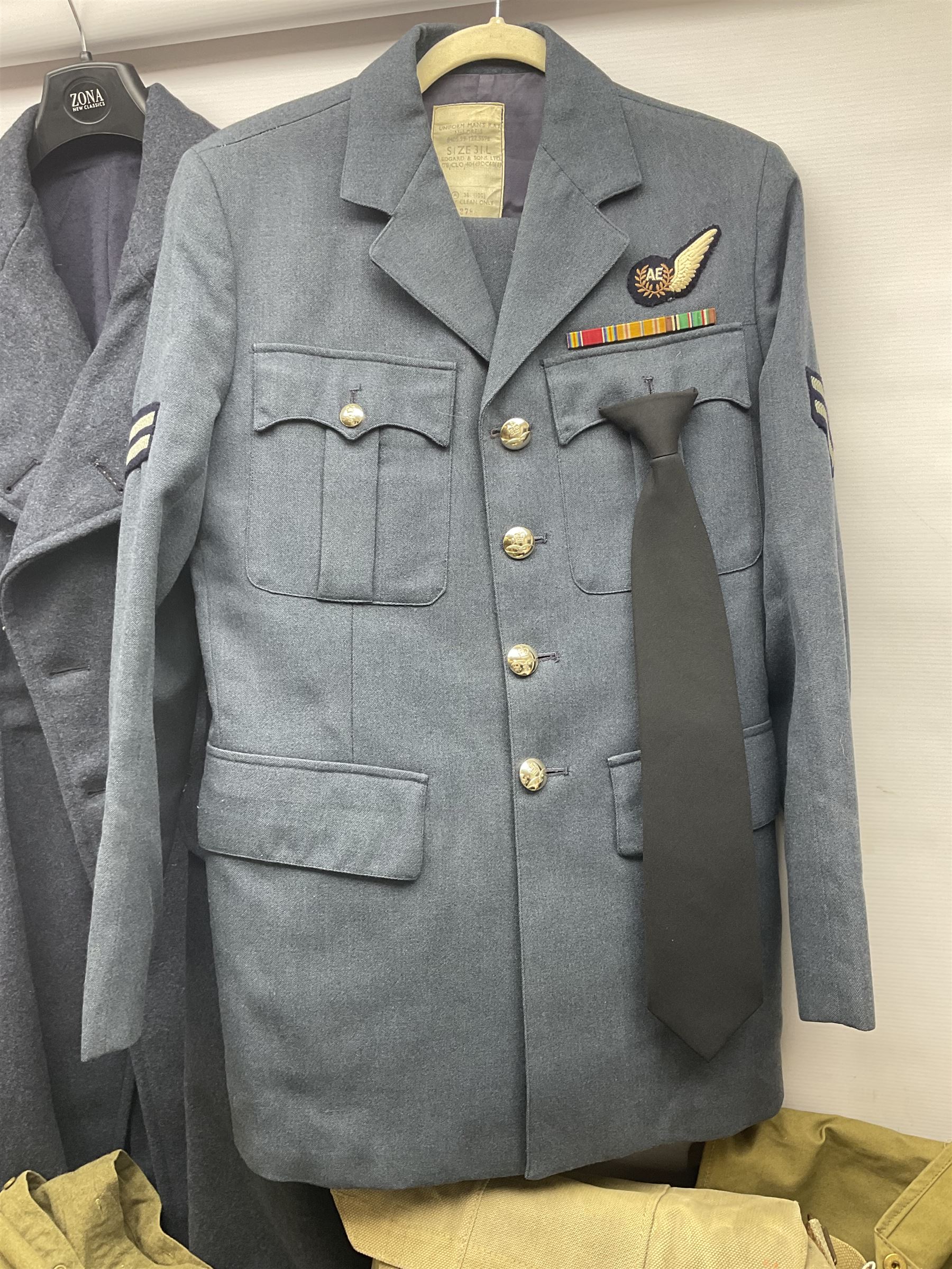 Two post-WWII British Army No.2 Dress tunics, one with Green Howards buttons; army shirt dated 1951; Royal Fleet Auxilliary jacket with trousers; three RAF/WAAF uniforms and RAF Greatcoat; and three canvas/webbing bags, two dated 1943 & 1945