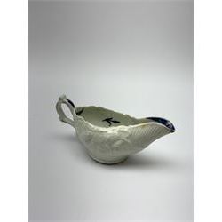 18th century reeded and foliate moulded cream boat, probably Liverpool, the interior decorated with floral sprigs, L12cm