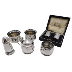 Group of silver, comprising pair of 1920's cruets of plain cylindrical form with domed covers, hallmarked Miller Brothers, Birmingham 1921, in fitted case, pair of late Victorian open salts with crimped rims, hallmarked William Hutton & Sons Ltd, Birmingham 1899, and a set of three 1920's cruets, comprising pepper, open salt, and mustard pot and cover with blue glass liner, hallmarked Mappin & Webb Ltd, Birmingham 1927, approximate total silver weight 4.38 ozt (136.3 grams)