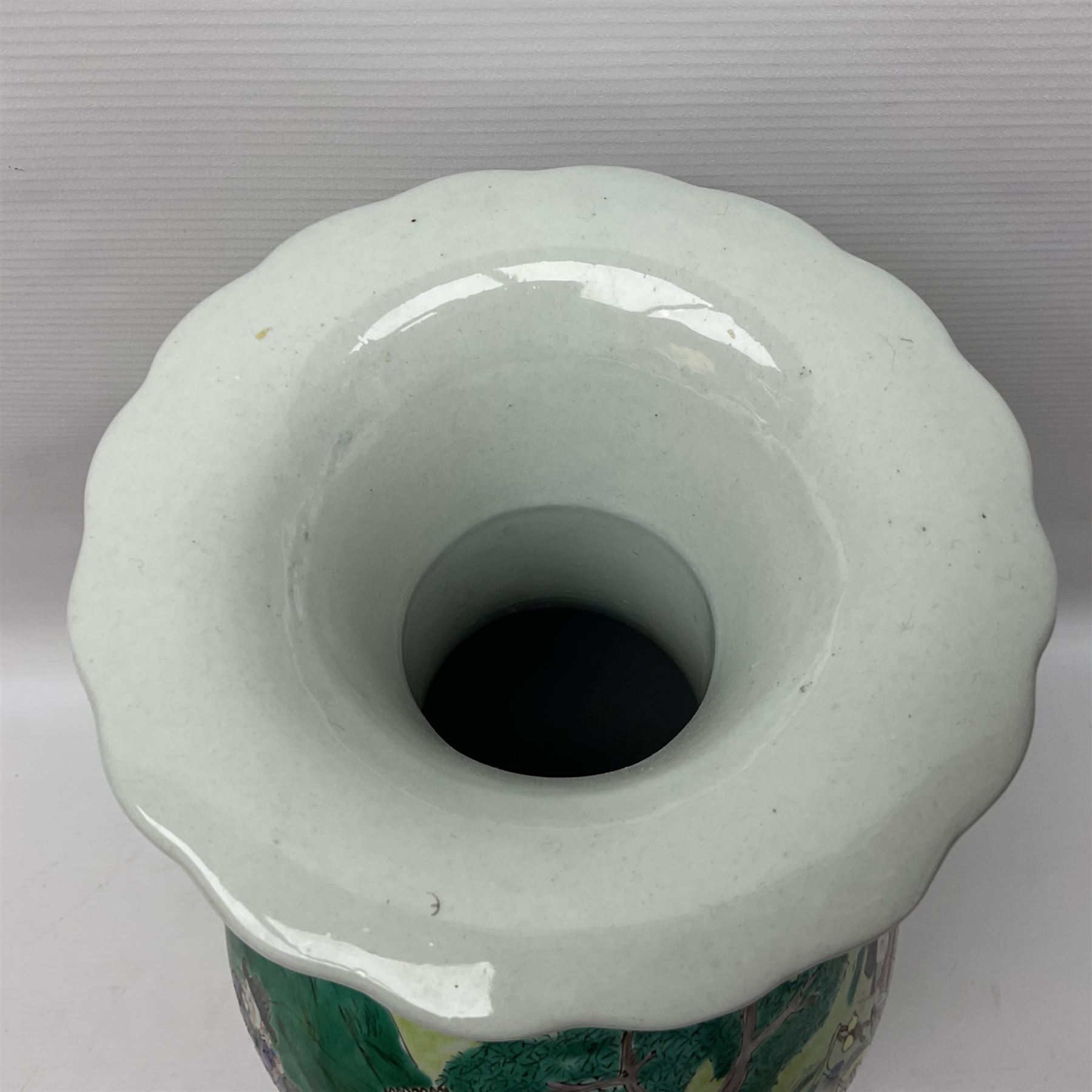 20th century Chinese Famille Rose vase, of baluster form with flared lobed rim and twin figural handles, decorated in polychrome enamel with figures dancing and playing instruments within a garden setting, H42cm