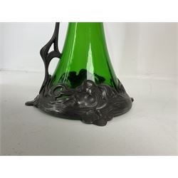 Early 20th century WMF Art Nouveau pewter and green glass ewer, of swept cylindrical form, having a pierced stopper and handle of entwined stems and berry design, the base cast as water nymphs with flowing hair and lily pads, H38cm