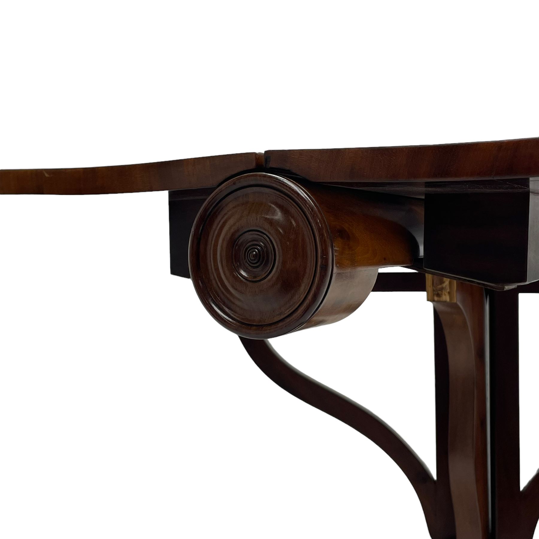 Unusual William IV mahogany Sutherland table, figured and book-matched rectangular drop-leaf top on cylindrical barrel movement, turned roundels to each end, on turned pedestal with acanthus carved baluster, shaped platform with four extended paw feet