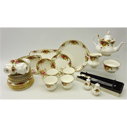  Royal Albert 'Old Country Roses' pattern tea ware Comprising eight cups and saucers, eight tea plates, milk jug, salt and pepper, teapot, cake knife, sandwich serving plate, cake plate, sugar bowl and small dish  