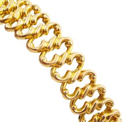 Victorian gold pearl and diamond expanding bracelet, the flower head centrepiece set with a single old cut diamond of approx 0.20 carat, with split pearl surround, on an expanding bracelet, stamped 18ct