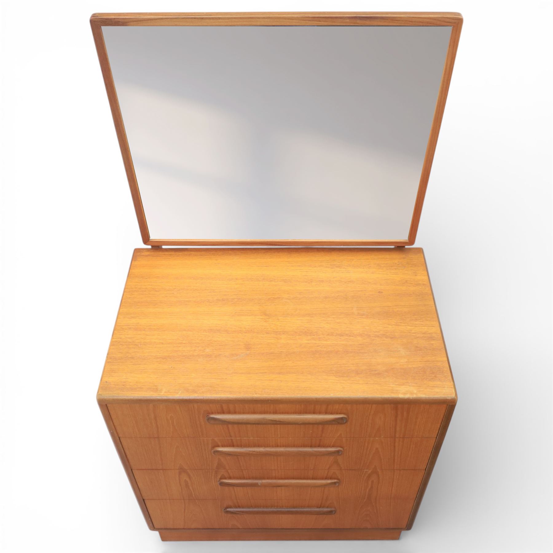 G Plan - 'Fresco' chest of drawers and mirrored dresser, chest of drawers with six drawers, dresser with four graduating drawers and swing mirror surrounded in teak, both raised on a recessed plinth base
Chest H 99cm, W 53cm, D 45cm
Dresser H 136cm, W 72cm, D 48cm