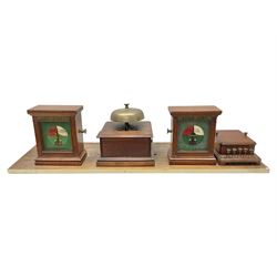 Railway signal boxes, mounted on plinth, with railway block indicators for Up Line and Down Line, having an electromagnetic indicator showing 'Train on Line' 'Line Clear' and 'Line Blocked', and brass signal bell to the centre, L100cm