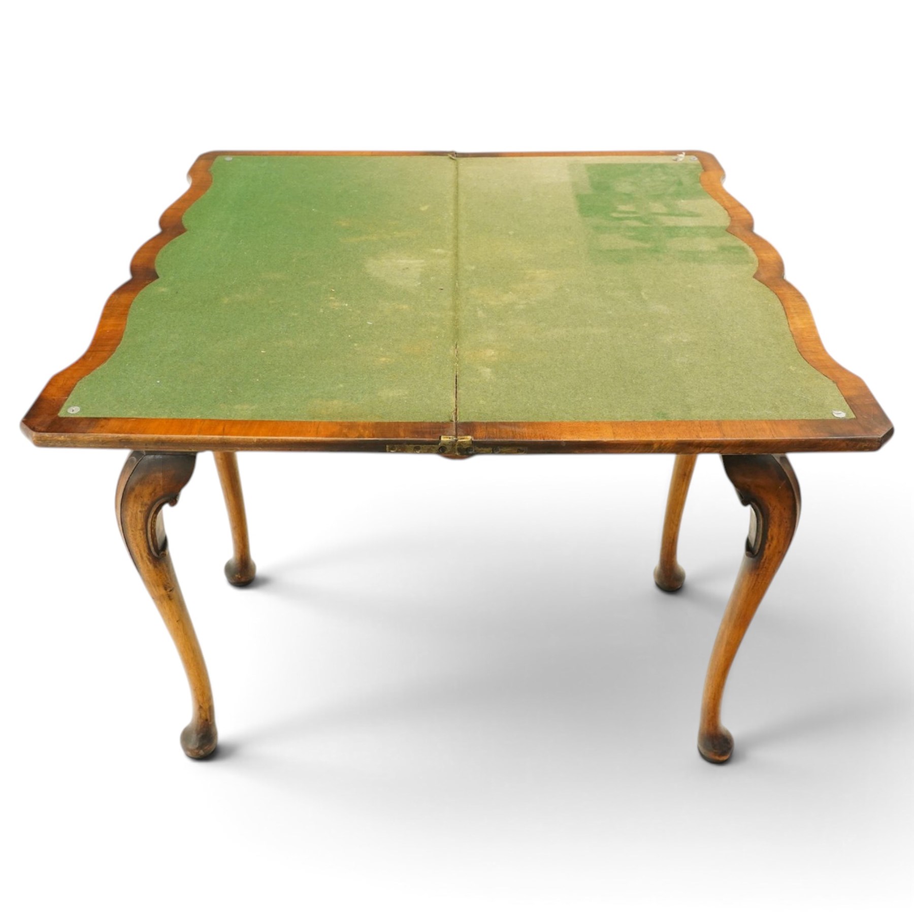 Quality early 20th century Queen Anne design walnut card table, rectangular book-matched veneer fold-over and swivel top with scalloped edge enclosing baize-lined interior, fitted with shaped frieze drawer with brass pear-drop handles over shaped apron, raised on C-scroll carved cabriole supports with pad feet