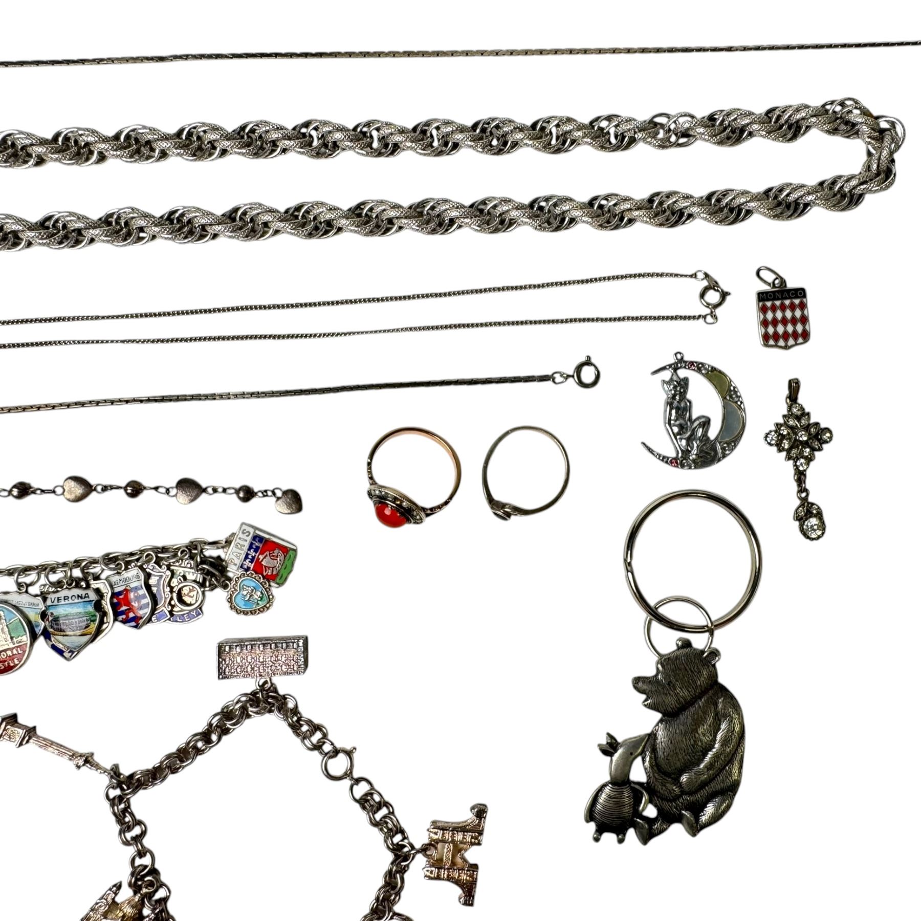 9ct gold stone set ring and silver enamel town badge charm bracelet, cross pendant, ring and heart link bracelet, and a collection of costume jewellery