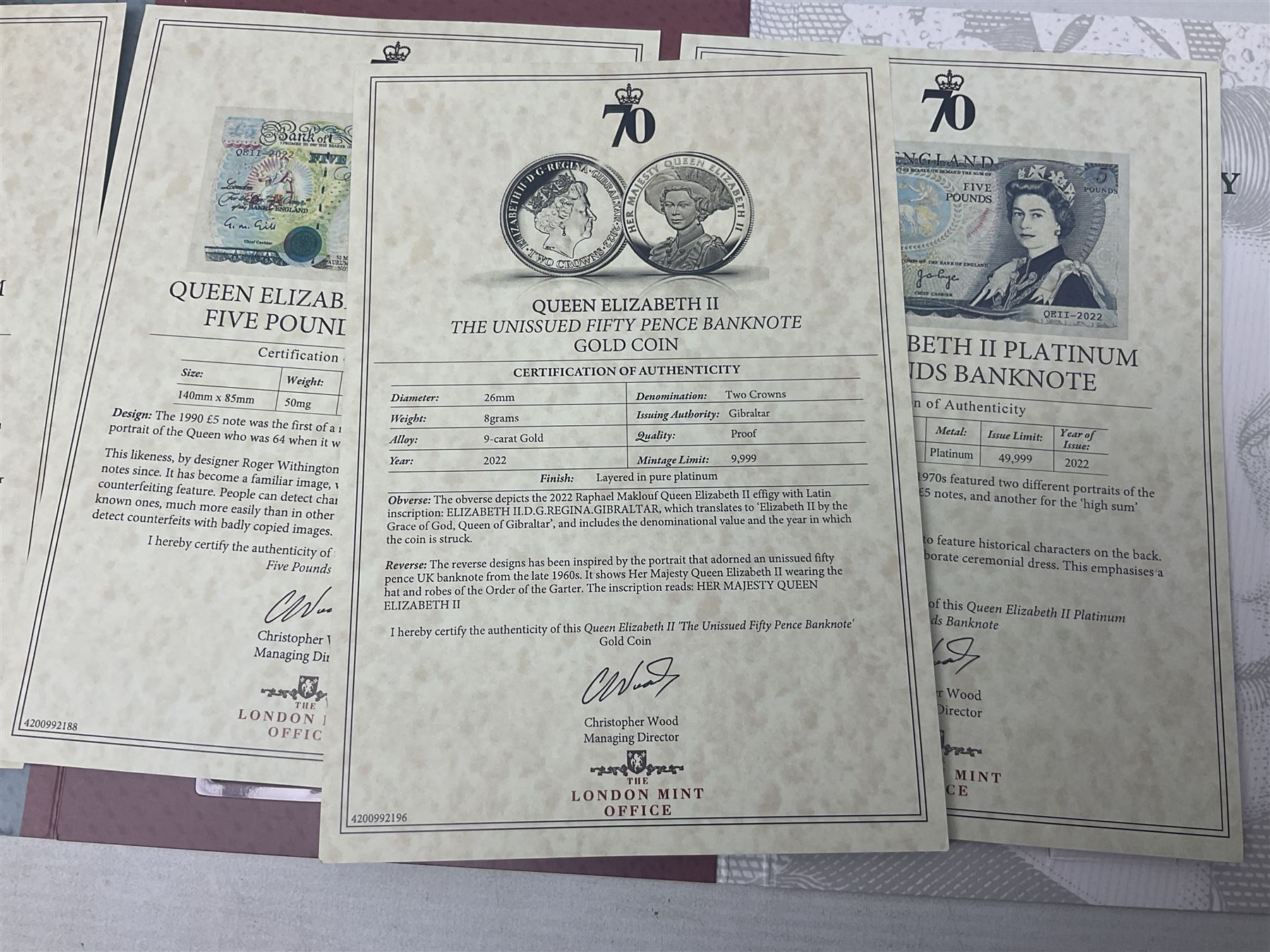 Queen Elizabeth II 'The Platinum Jubilee Banknote Collection' including 2022 'The Unissued Fifty Pence Banknote Gold Coin', housed in official card folder with certificates