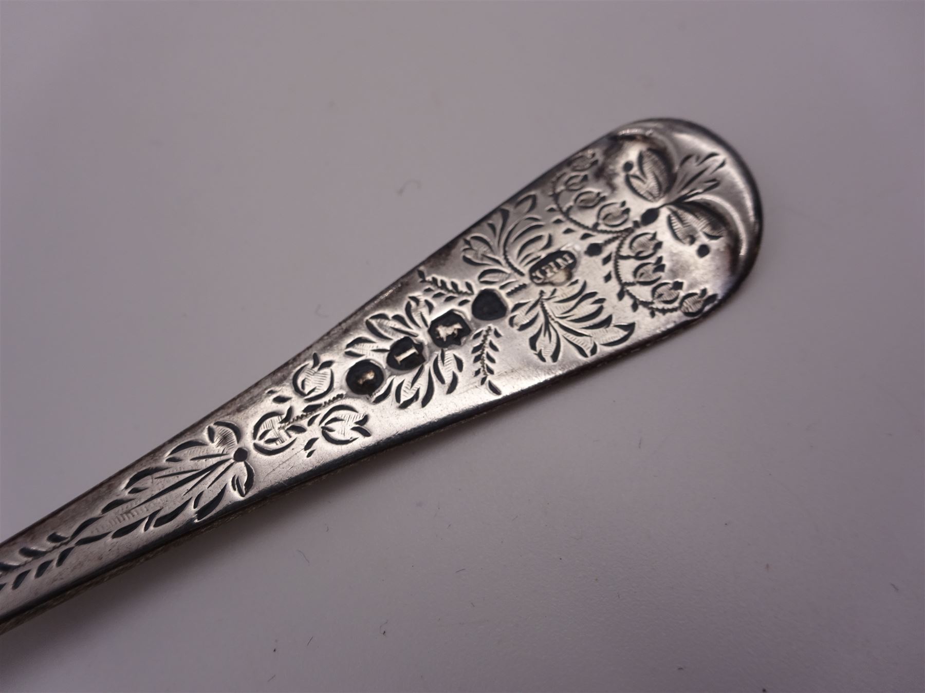 Victorian silver four piece christening set, comprising a beaker mug, napkin ring, fork and spoon, with bright cut floral decoration and monogrammed initials to each item, mug hallmarked Mappin & Webb (John Newton Mappin), Sheffield 1884, within tooled leather fitted case