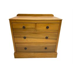 Edwardian satin walnut chest, fitted with two short and two long drawers, plinth base