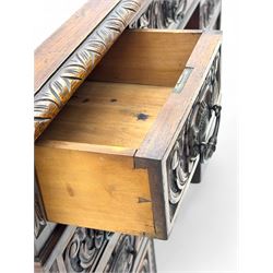 Late 19th century carved oak twin pedestal desk, rectangular top with inset leather writing surface, fitted with nine drawers, carved with scrolling foliate decoration, in three sections