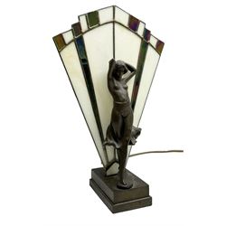 Art Deco style table lamp, modelled in the form of a bronzed female figure before a leaded glass fan shaped shade, H38cm