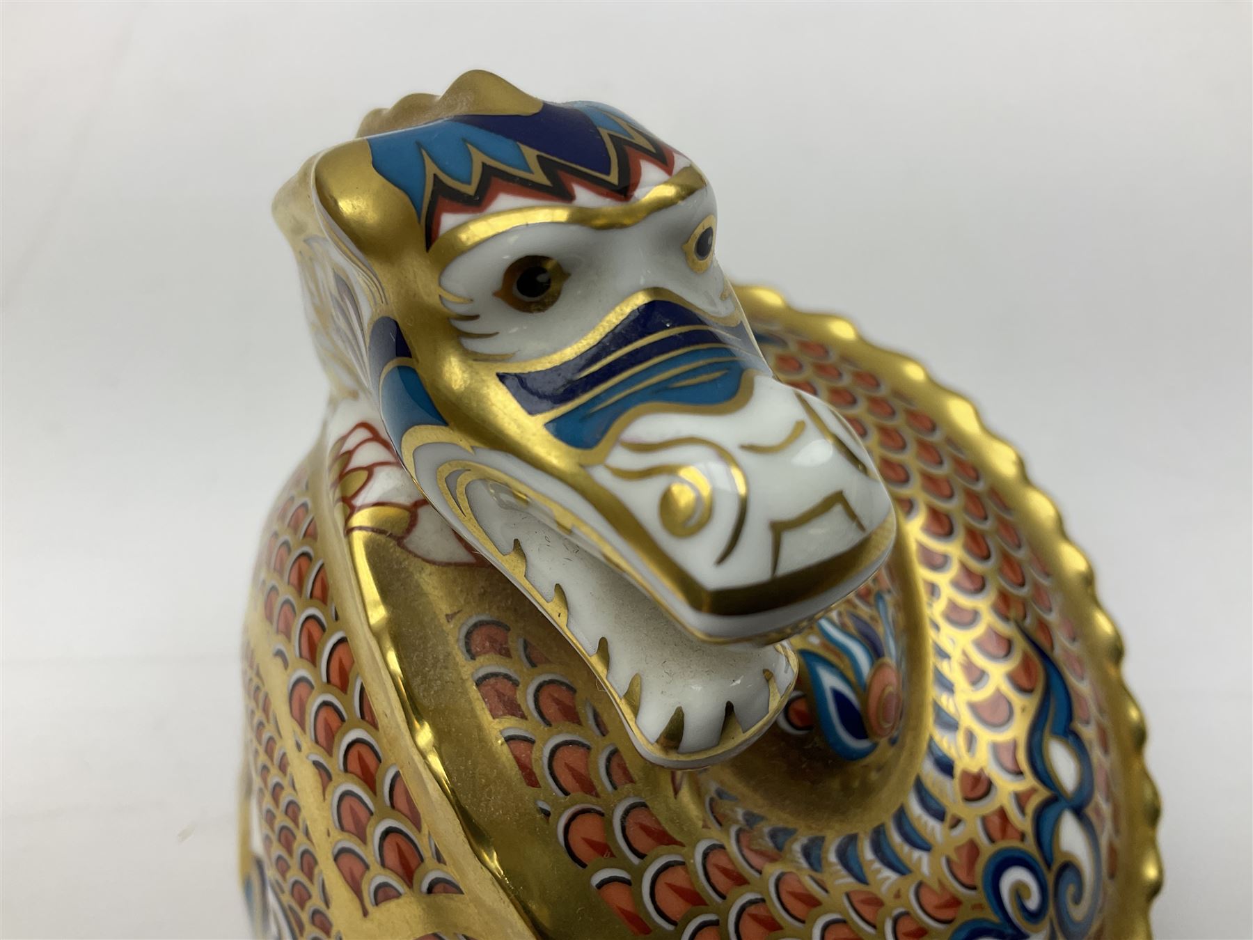 Two Royal Crown Derby paperweights, Dragon of Happiness, limited edition 1227/1500 and Dragon of Good Fortune, limited edition 1227/1500, both with gold stopper, hardwood base, certificate and with printed mark beneath