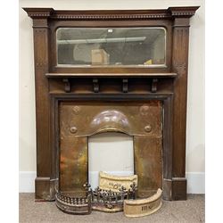 Late 19th/early 20th century fireplace, oak surround with projecting dentil cornice over bevelled mirror and shelf, with copper inset decorated with Heraldic knot motifs and rivets, together with various fire accessories 