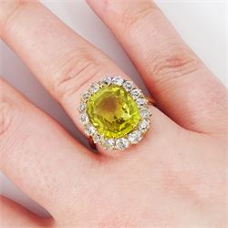 Early 20th century gold chrysoberyl and diamond cluster ring, single cushion cut yellow / green chrysoberyl of approx 8.00 carat, surrounded by sixteen old cut diamonds, stamped 18ct, total diamond weight approx 1.10 carat