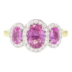18ct gold pink sapphire and diamond trilogy ring, three oval cut sapphires surrounded by r...