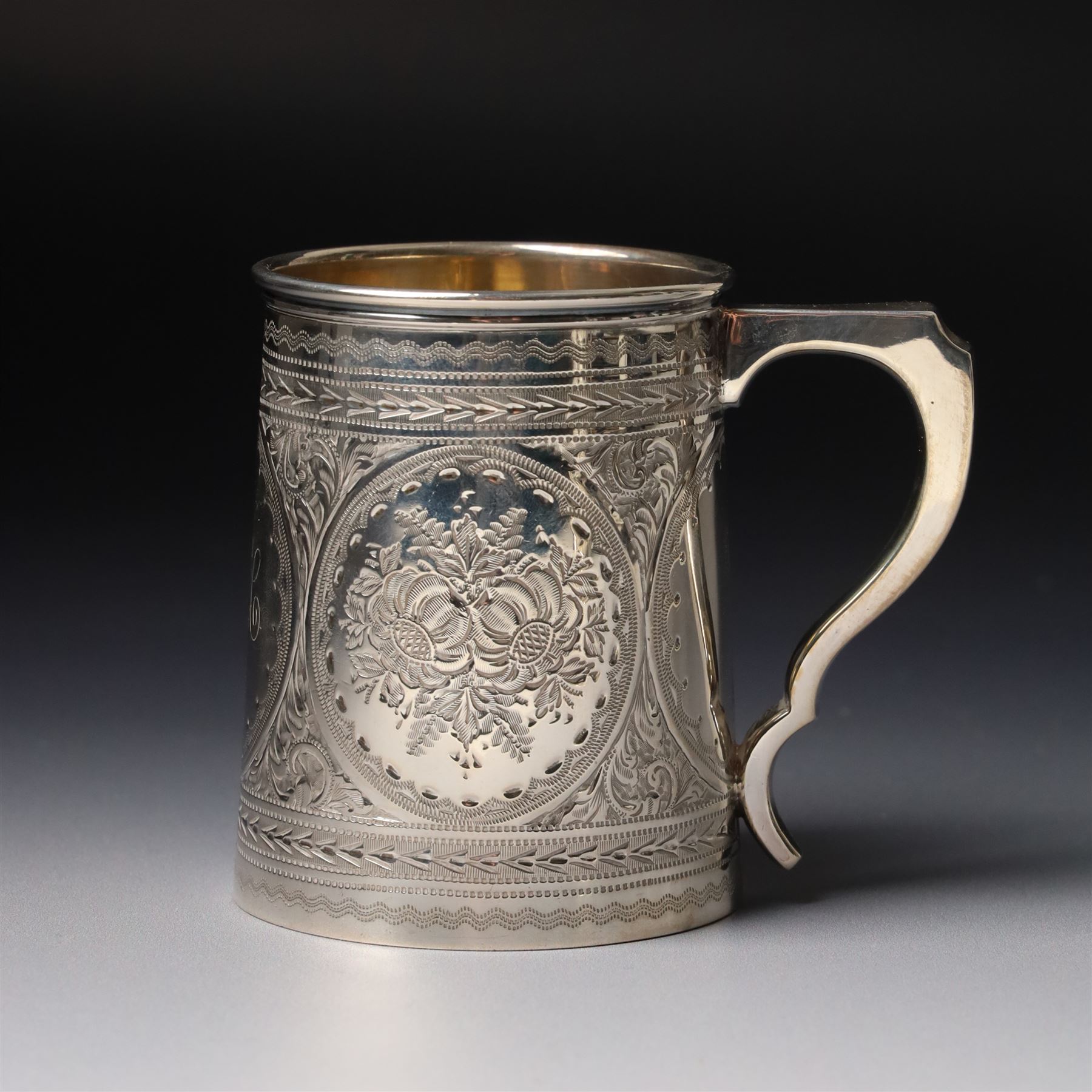 Edwardian silver christening mug with engraved decoration H8cm Birmingham 1902 and two others 1900 and 1902