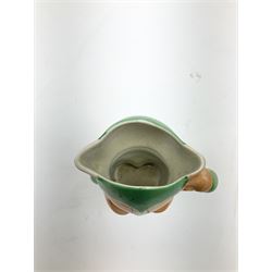 Shelley Boo Boo three piece tea set designed by Mabel Lucie Attwell, comprising teapot modelled as a house, sugar bowl modelled as a toadstool, and creamer modelled as an elf, each with printed marks beneath, together with a Shelley Mabel Lucie Attwell teacup and saucer. 