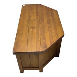 Contemporary mango wood television stand, wide planked surface and angled back corners, central shelving section flanked by twin cupboard doors with square pull handles, raised on stile supports