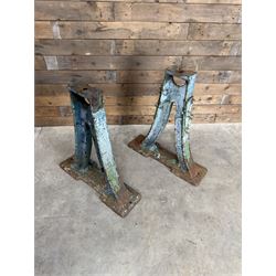 Pair of late 19th century heavy cast iron garden industrial trestles, painted in distressed blue paint
